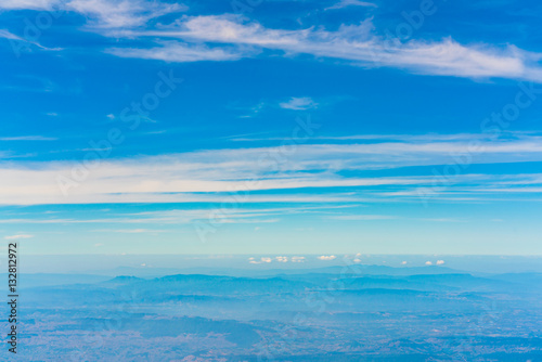 Mountains under clouds. View from the airplane . © jannoon028