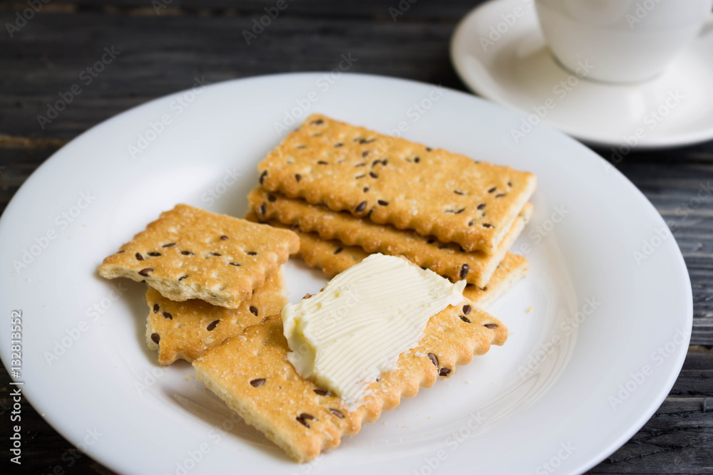Crackers with sesame seeds on a wooden table in rustic style Crackers with sesame seeds on a wooden table in rustic style