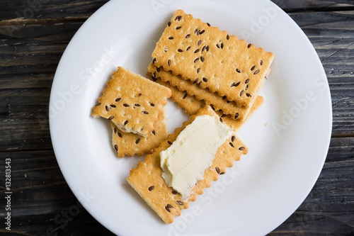 Crackers with sesame seeds on a wooden table in rustic style