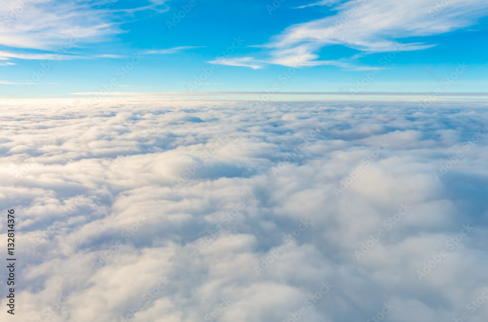 Sunrise above clouds from airplane window . Sunrise above clouds from airplane window .