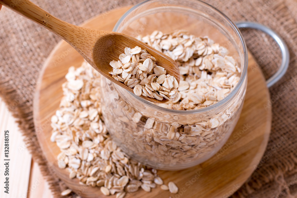 Raw oatmeal in a glass jar Raw oatmeal in a glass jar