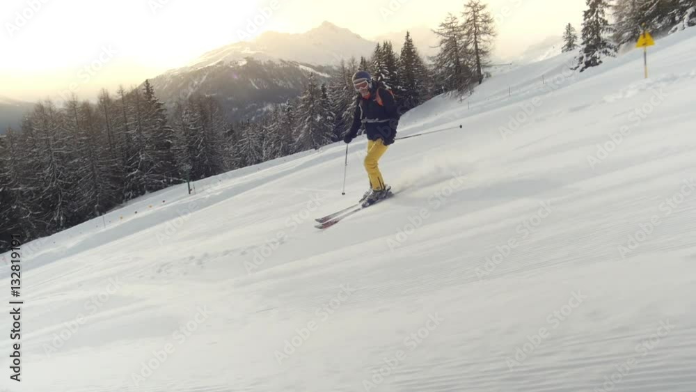 camera fluently tracking along with skier going downhill