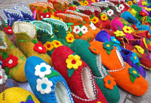 Handmade colorful wool slippers or shoes for sale at street in Tbilisi, Georgia