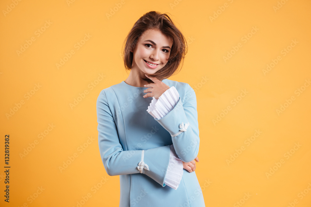 Portrait of happy beautiful young woman in blue dress Portrait of happy beautiful young woman in blue dress