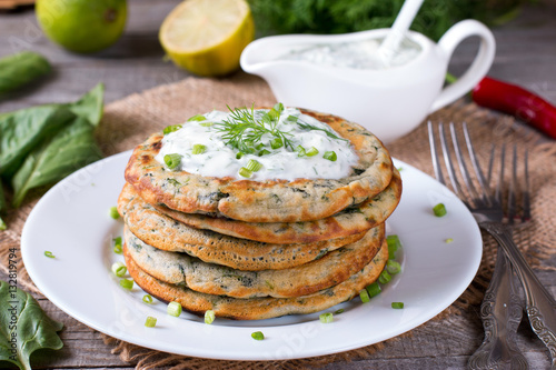 Green pancakes with spinach and sauce