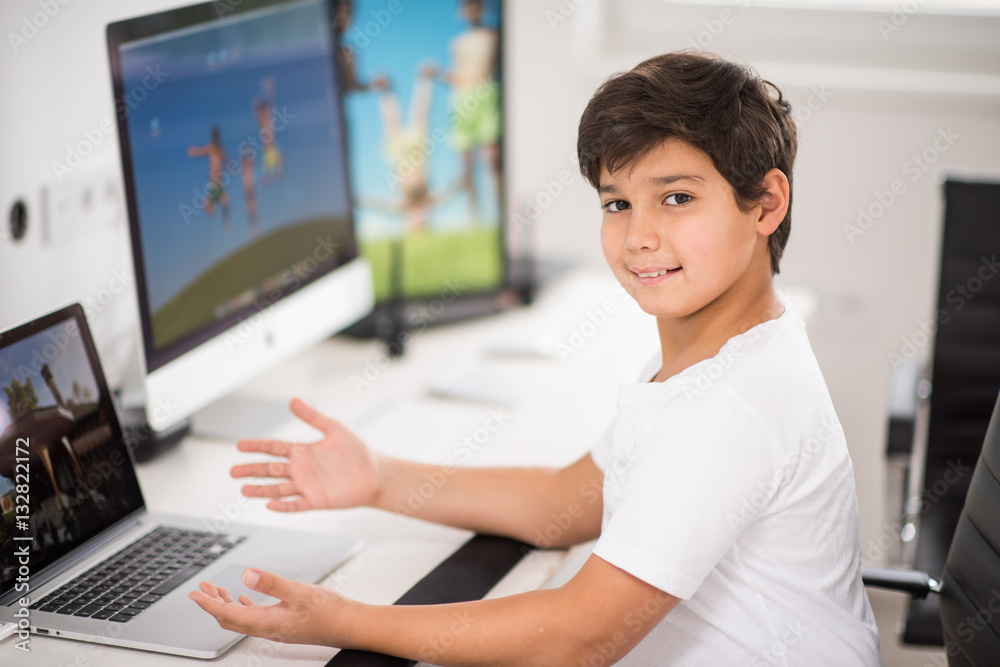 Kid working on computer Kid working on computer