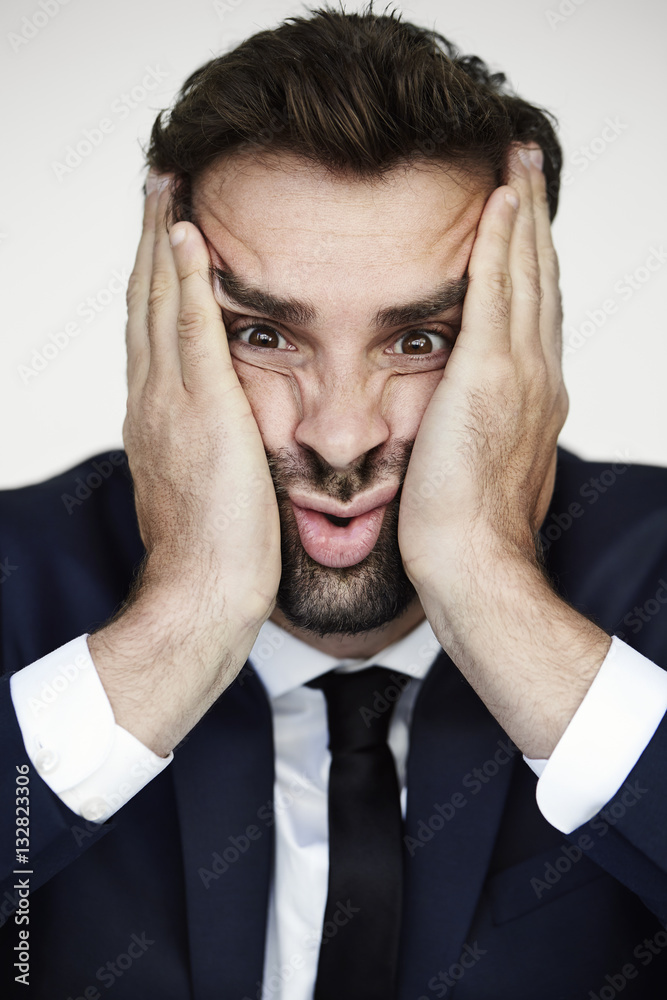 Businessman squashing face to camera Businessman squashing face to camera