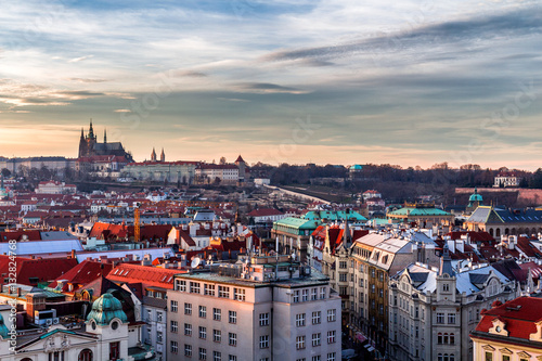 Old Town of Prague (Czech Republic) in sunset. Skyline with Old town and Castle (Hrad) of Prague in the background. Picture represents main landmarks of spectacular city.