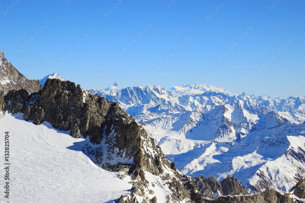 Winter landscape in Alps with Matterhorn an Monte Rosa peaks in background