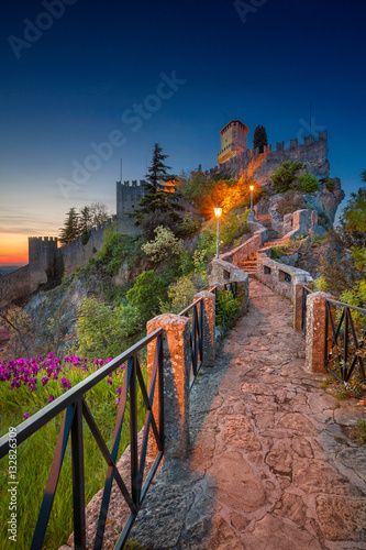 San Marino. Image of castle in San Marino during sunset. photo