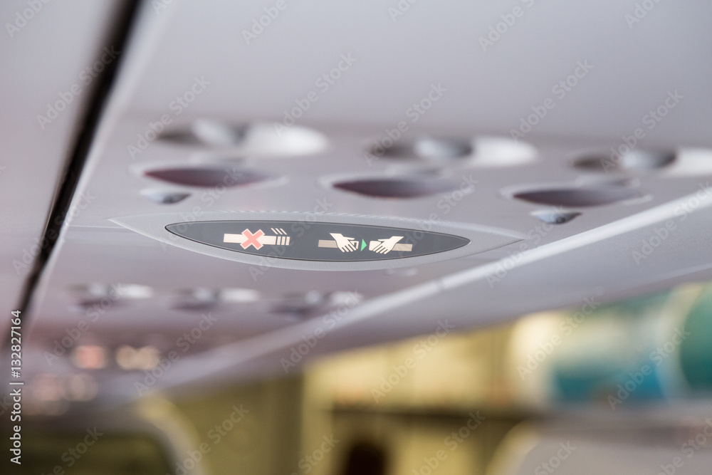 Plane interior No Smoking and Buckle Seat-Belt signage Plane interior No Smoking and Buckle Seat-Belt signage