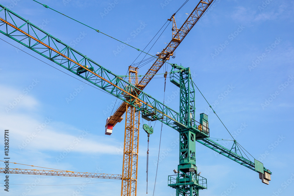 crane tower on sky background at construction site