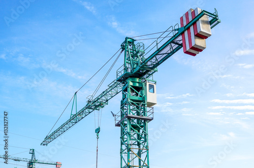 crane tower on sky background at construction site