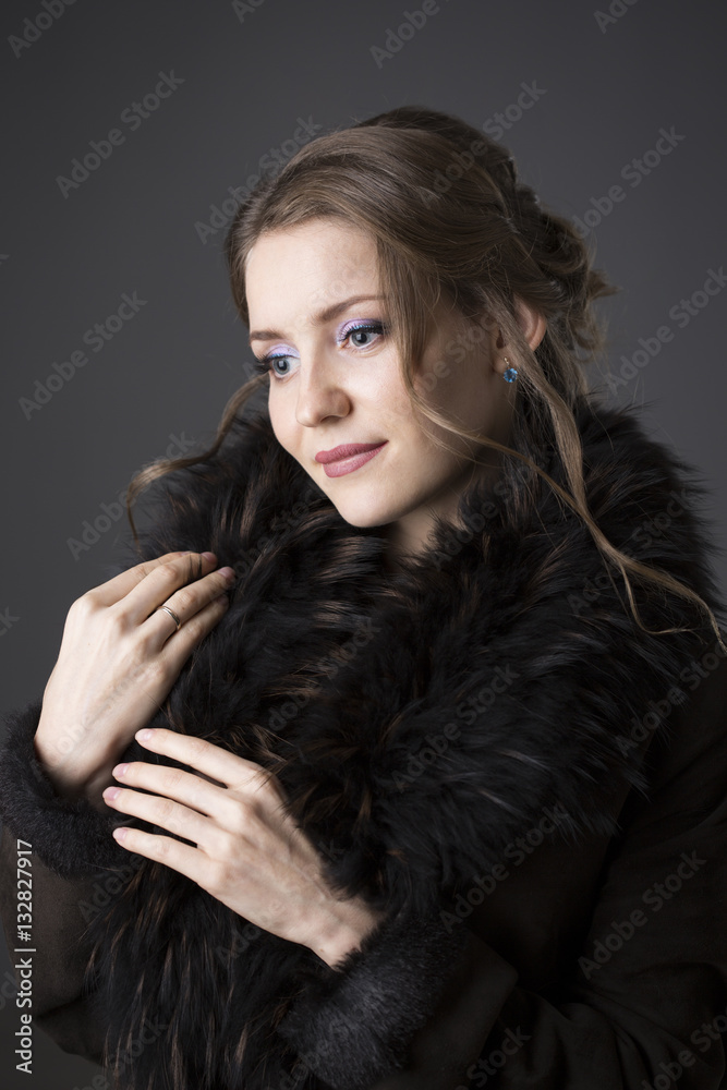 woman in a black fur coat