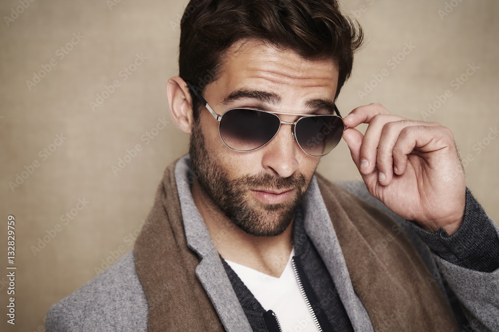 Obraz premium Sunglasses and scarf guy in studio, portrait