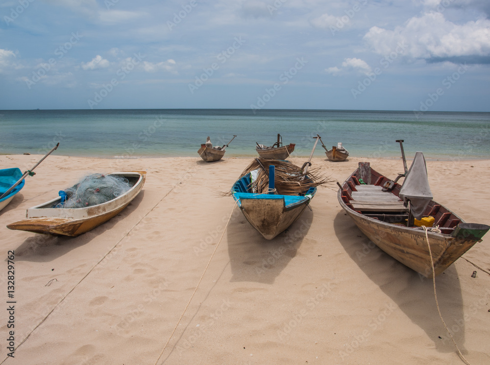 Fishing boats parked on the beach during the day. (6) Fishing boats parked on the beach during the day. (6)