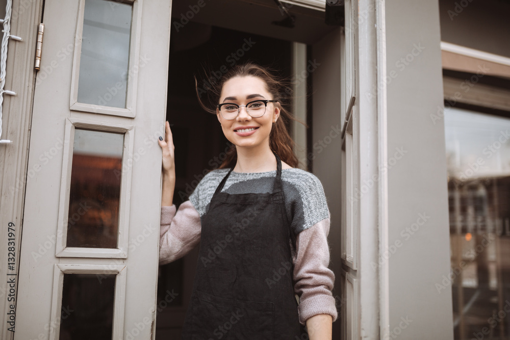 Fototapeta premium Woman confectioner standing near cafe outdoors
