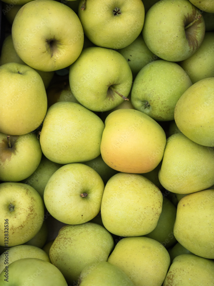 Background of green apples close up. Green apples pattern on sale at the market. Background of green apples close up. Green apples pattern on sale at the market.