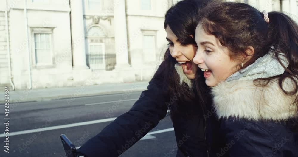 Outdoor portrait of teen friends taking photos with a smartphone.Teenage girls making self portrait. Selfie. Slow motion. Red Epic 4k. Outdoor portrait of teen friends taking photos with a smartphone.Teenage girls making self portrait. Selfie. Slow motion. Red Epic 4k.