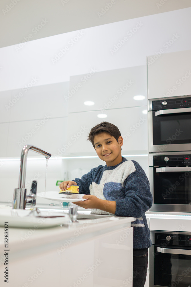 Child in modern white kitchen Child in modern white kitchen