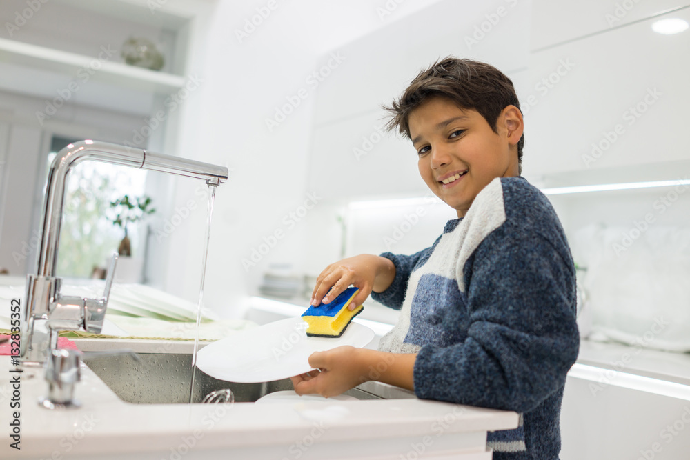 Child in modern white kitchen Child in modern white kitchen