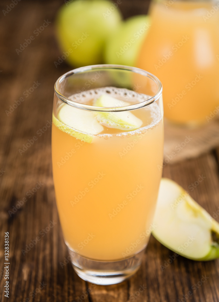 Fresh made Apple Juice on a rustic background