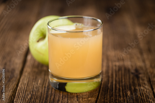 Apple Juice on vintage wooden background