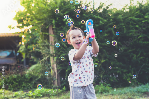 blurred Thai kids play bubble 