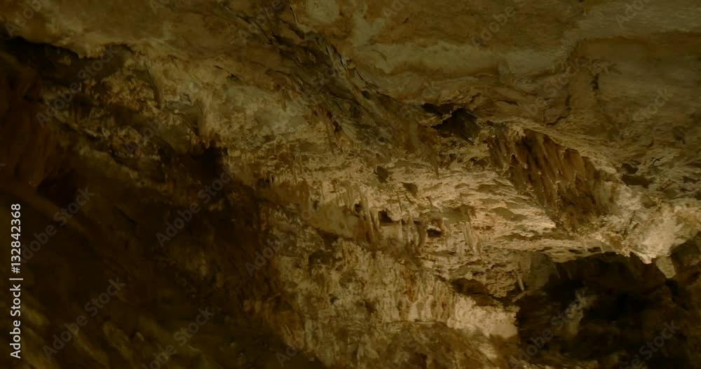 Limestone rocks, stalactites and stalagmites in a cave Limestone rocks, stalactites and stalagmites in a cave