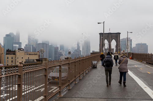 Views across the bridge walking the Brooklyn Bridge in New York © josevgluis