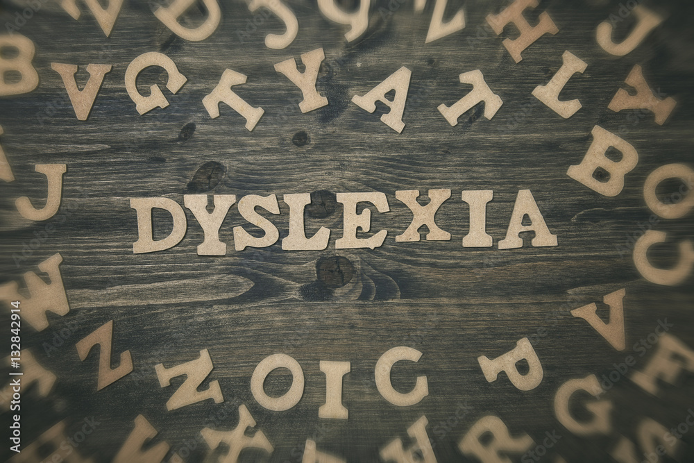 Word dyslexia on a wooden background - obrazy, fototapety, plakaty 