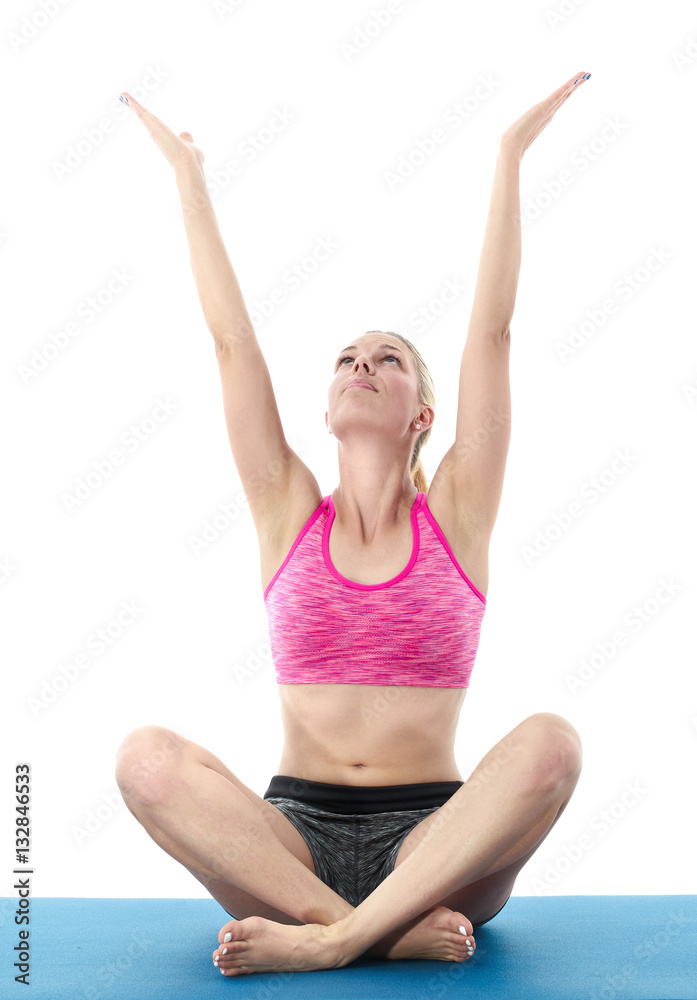 Woman making pilates mat exercises Woman making pilates mat exercises