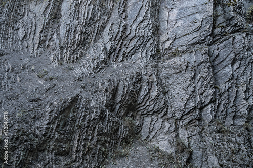 Background from a dark and rough rock wall
