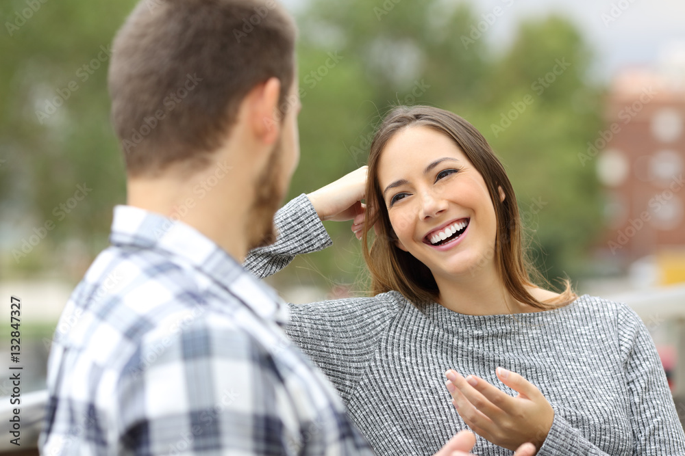 Happy couple talking in a balcony Happy couple talking in a balcony