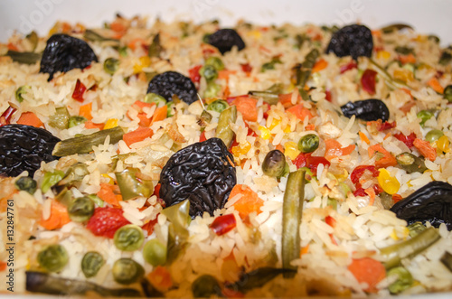 baked in the oven rice with vegetables and prunes 