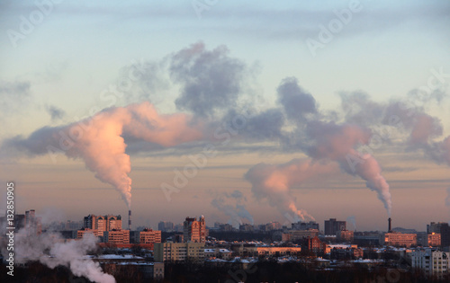 Smoke from industrial chimneys at dawn