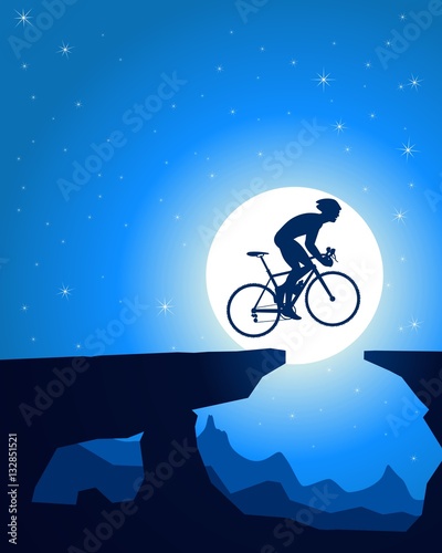 Cyclist jumping off the rocks, moonlight