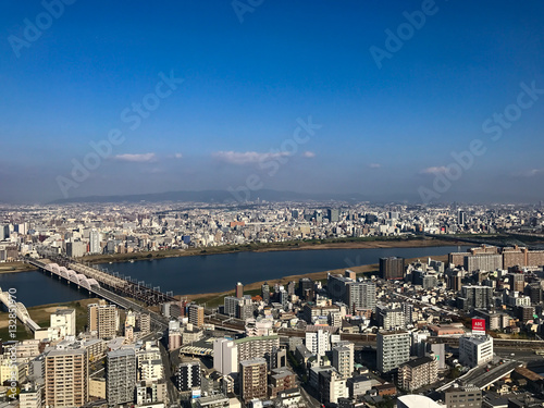 Osaka sunset to night amidst the winds of change