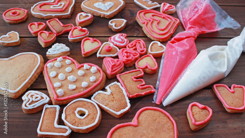heart shape and word LOVE valentine homemade cookies with pastry bags