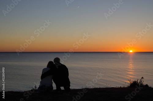 Couple by a romantic sunset
