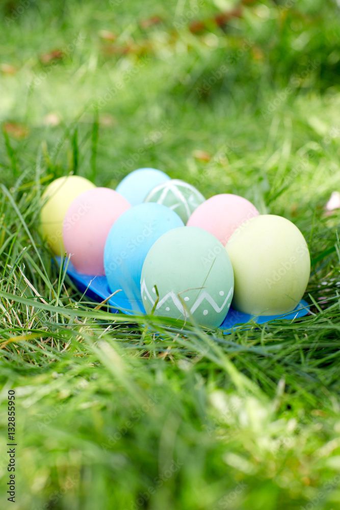 Easter eggs on green grass. Easter holidays concept
