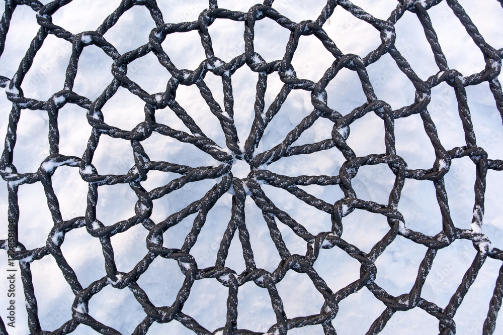 Naklejka premium Rope texture of an swing chair in the snow