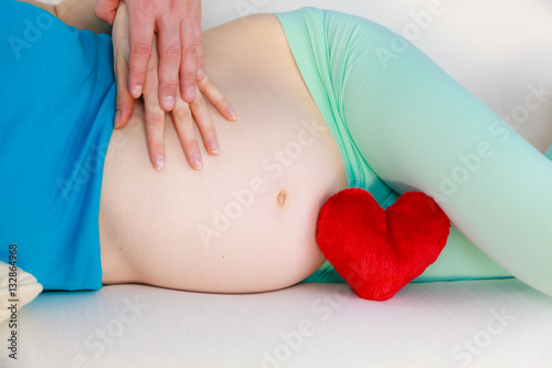 Wallpaper Mural Couple expecting baby, their hands touching pregnant belly Torontodigital.ca