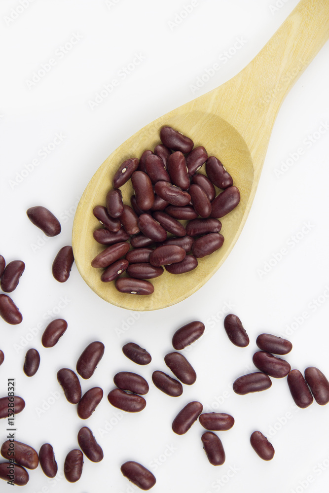 Fototapeta premium Red bean on wooden spoon on white background