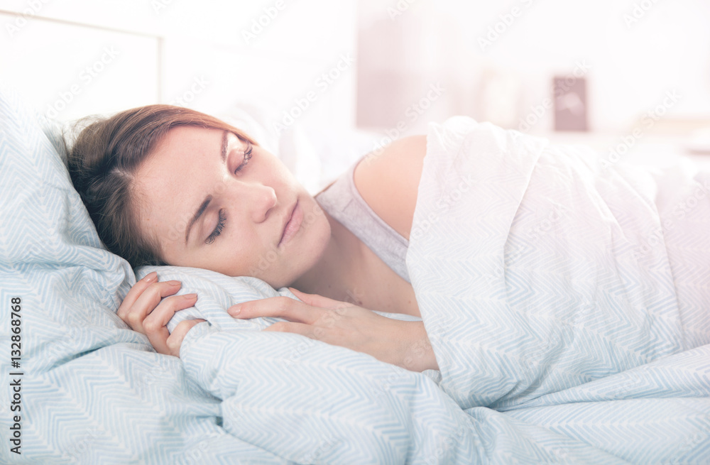 Girl peacefully sleeping in the morning before waking up Girl peacefully sleeping in the morning before waking up