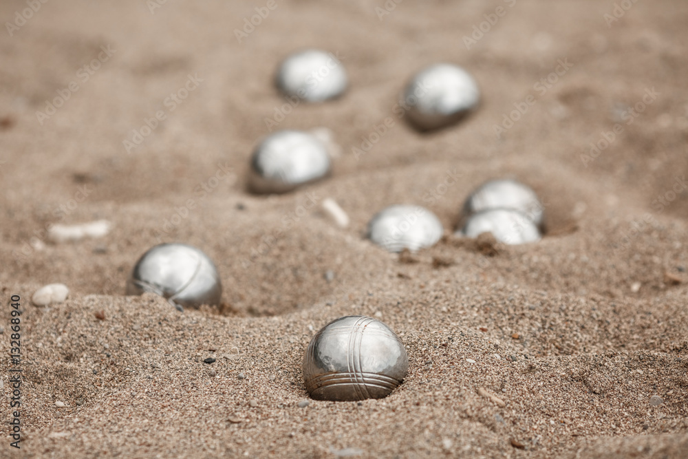 Bocce petanque balls on sand beach Bocce petanque balls on sand beach