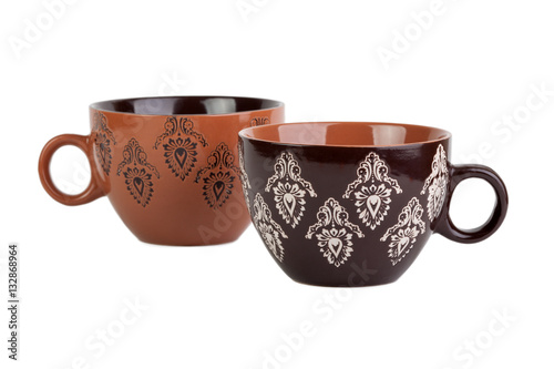 two brown cups with pattern isolated on white background