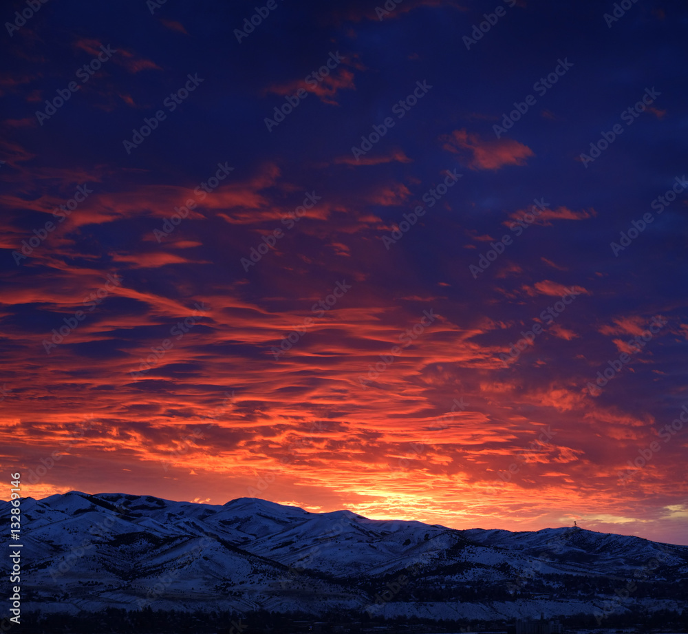 Fototapeta premium Sunset with Mountains in Wilderness Sky Clouds
