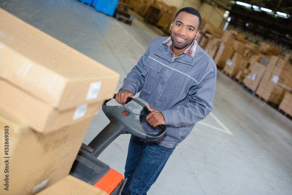 warehouse worker with pushcart warehouse worker with pushcart