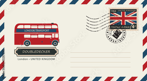 an envelope with a postage stamp with London doubledecker, and the flag of United Kingdom photo